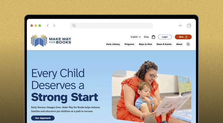 A woman and a young child sit together reading a picture book on a website promoting early literacy with the heading, “Every Child Deserves a Strong Start.”.